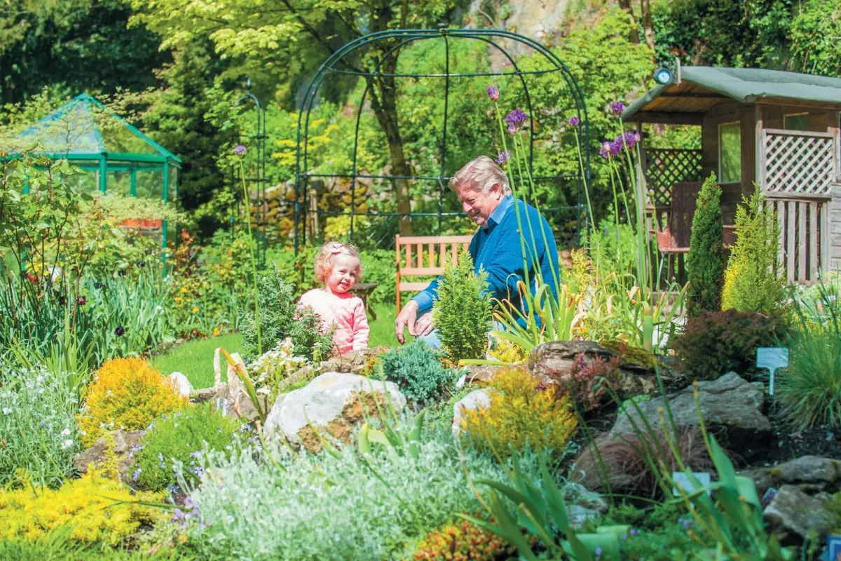 two people in beautiful garden enjoying the moment