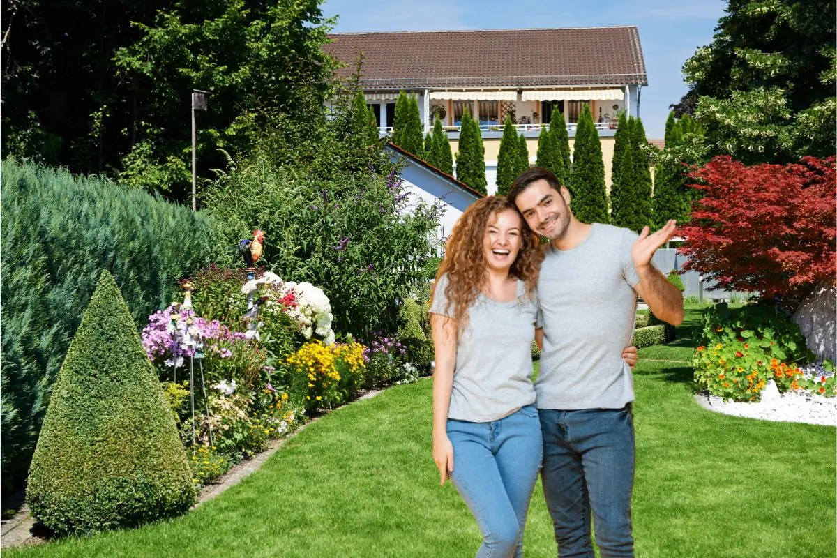 happy couple standing on beautiful landscape garden