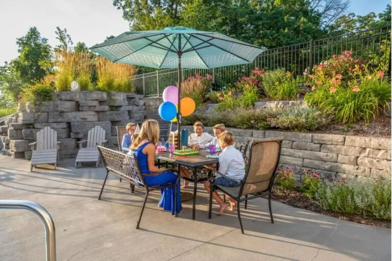 people enjoying while eating on garden hardscape